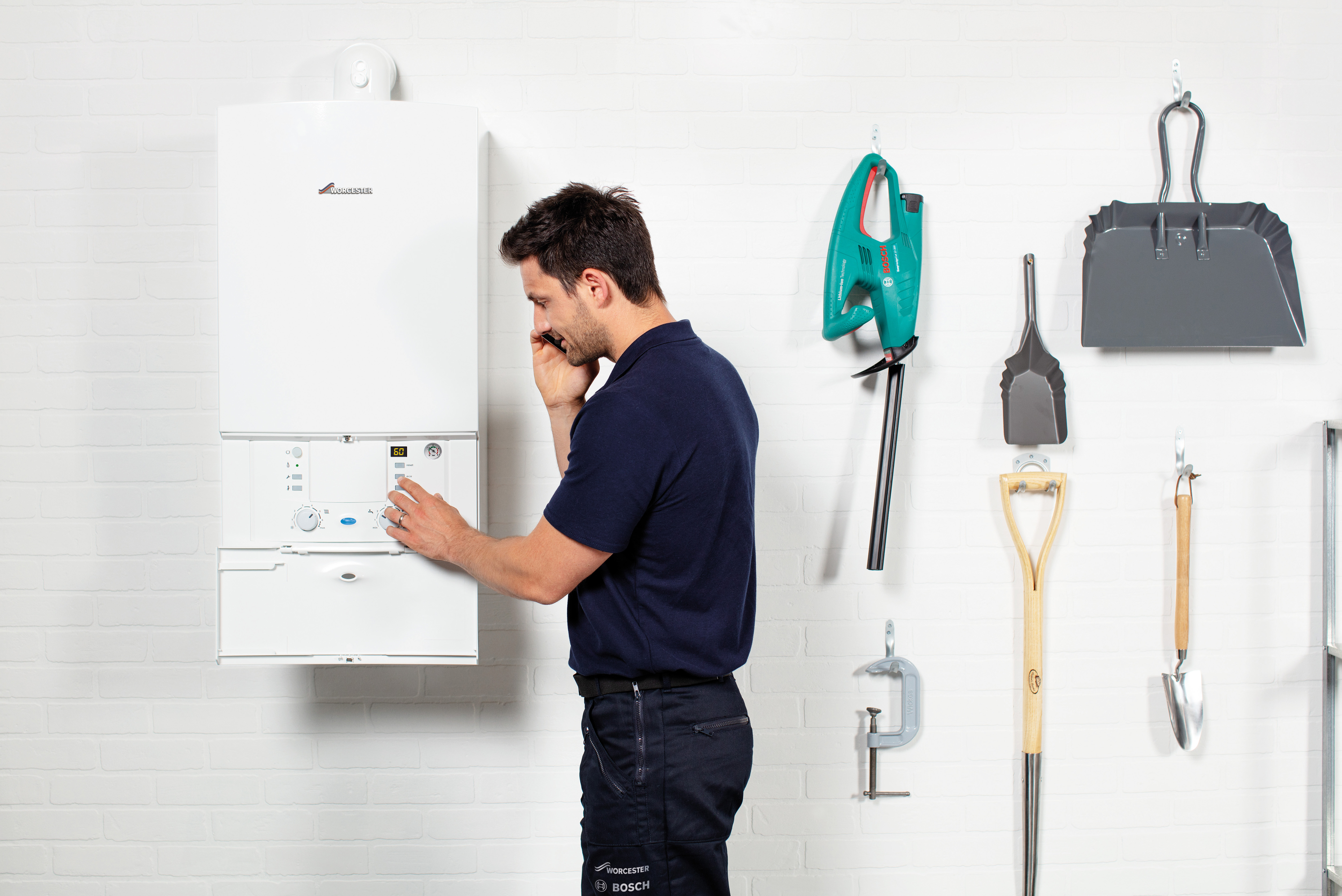 Engineer servicing boiler